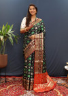 Black color soft patola silk saree with zari weaving work