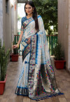 Firoji color dola silk saree with shibori print & zari weaving work