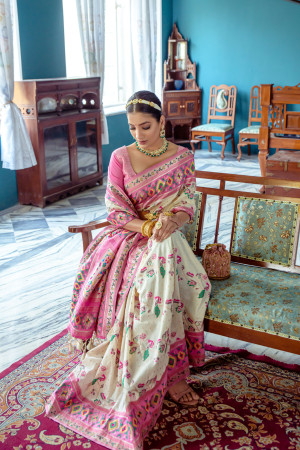 Off white color soft paithani patola silk saree with zari weaving work