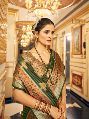 Green color soft organza silk saree with zari weaving work