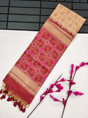 Off white color tussar silk saree with patola weaving design