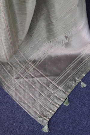 Pista green color tussar silk saree with zari weaving work