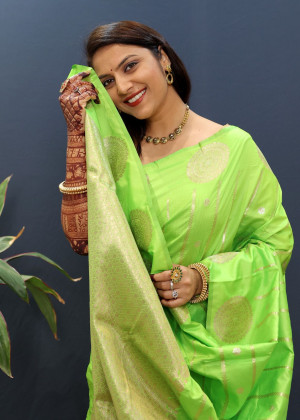 Parrot green color banarasi silk saree with zari weaving work