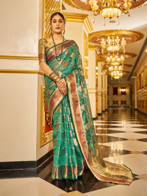 Rama green color soft organza silk saree with zari weaving work
