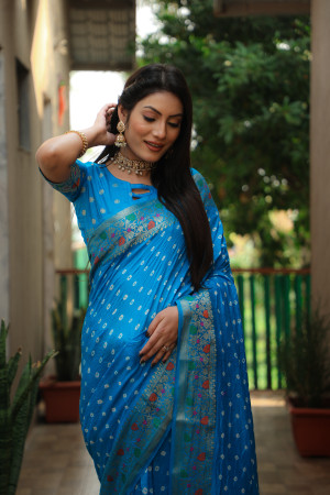 Sky blue color hand bandhej silk saree with zari weaving work