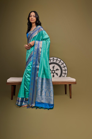 Sea green color tussar silk saree with bandhani weaving work