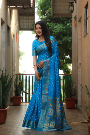 Sky blue color hand bandhej silk saree with zari weaving work