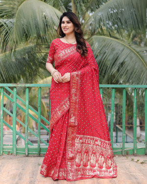 Red color hand bandhej saree with zari weaving work
