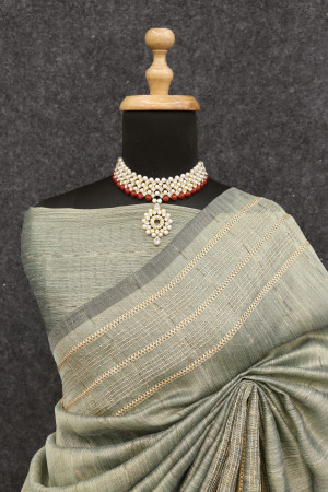 Mahendi green color tussar silk saree with zari weaving work
