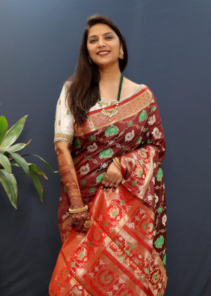 Maroon color soft patola silk saree with zari weaving work