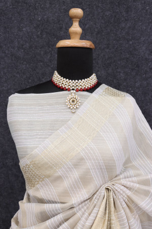 Light beige color tussar silk saree with zari weaving work