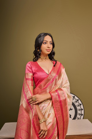 Off white color tussar silk saree with bandhani weaving work