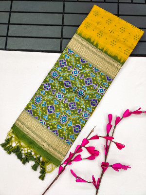 Yellow color tussar silk saree with patola weaving design