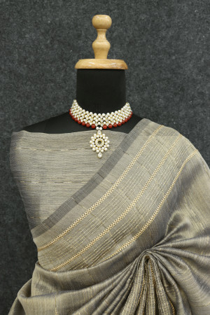 Beige color tussar silk saree with zari weaving work