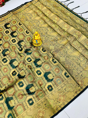 Dark green color organza silk saree with zari weaving work