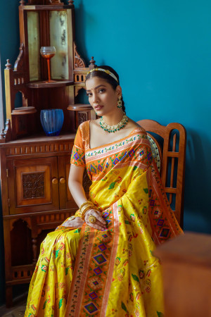 Yellow color soft paithani patola silk saree with zari weaving work