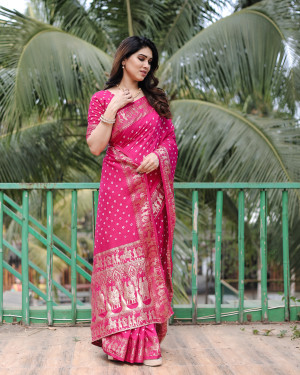 Rani pink color hand bandhej saree with zari weaving work