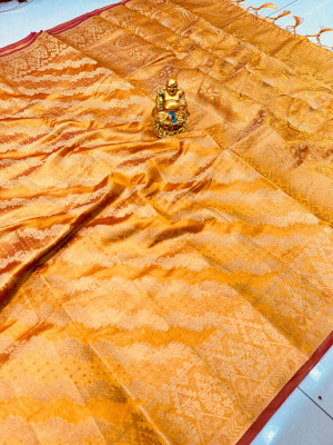 Orange color organza silk saree with zari weaving work