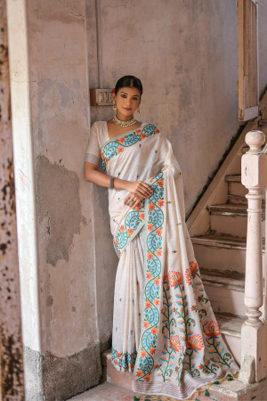 Off white color soft muga cotton saree with floral weaving work
