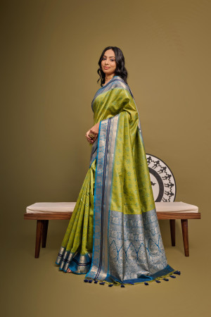 Mahendi green color tussar silk saree with bandhani weaving work
