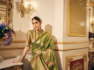 Mahendi green color soft organza silk saree with zari weaving work