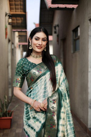 Green color dola silk saree with zari weaving work