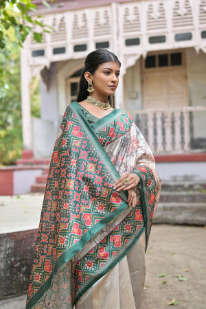 Green color soft tussar silk saree with patola printed work