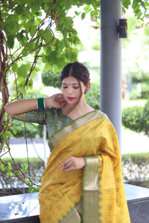 Yellow color tussar silk saree with weaving work