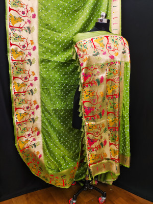 Pista green color bandhej silk saree with zari weaving work