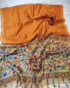 Orange color soft linen saree with traditional print work