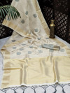 Cream color soft tissue linen silk saree with zari woven butti