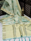 Sea green color soft tissue linen silk saree with zari woven butti