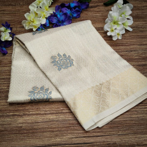 Cream color soft tissue linen silk saree with zari woven butti
