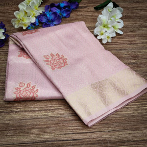 Pink color soft tissue linen silk saree with zari woven butti