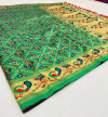 Green color patola woven design silk saree with gold zari weaving work