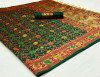 Dark green color patola silk saree with woven work