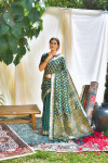 Dark green color tussar silk saree with zari weaving work