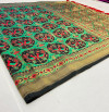 Green color patola woven design silk saree with gold zari weaving work