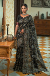 Black color tussar silk saree with zari woven border