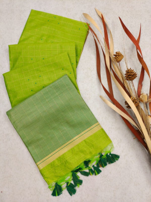 Parrot green color tussar silk saree with zari weaving border
