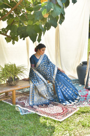 Navy blue color tussar silk saree with zari weaving work