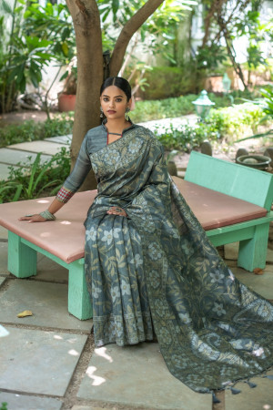 Gray color tussar silk saree with zari woven border