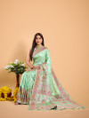 Pista green color soft banarasi silk saree with zari weaving work