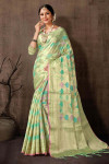 Sea green color organza silk saree with zari weaving work