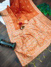 Orange color soft raw silk saree with woven design