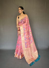 Baby pink color linen silk saree with woven design