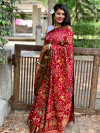 Maroon color pure hand bandhej silk saree with zari weaving work
