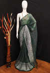 Dark green color soft georgette saree with foil printed work