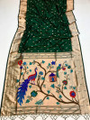Dark Green color paithani silk saree with zari weaving work