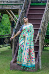 Sea green color paithani silk saree with zari weaving work